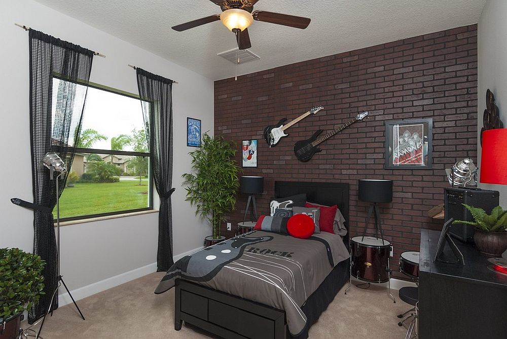 Cool teen bedroom with accent brick wall and guitar on the walls [Design: Stanley Homes]