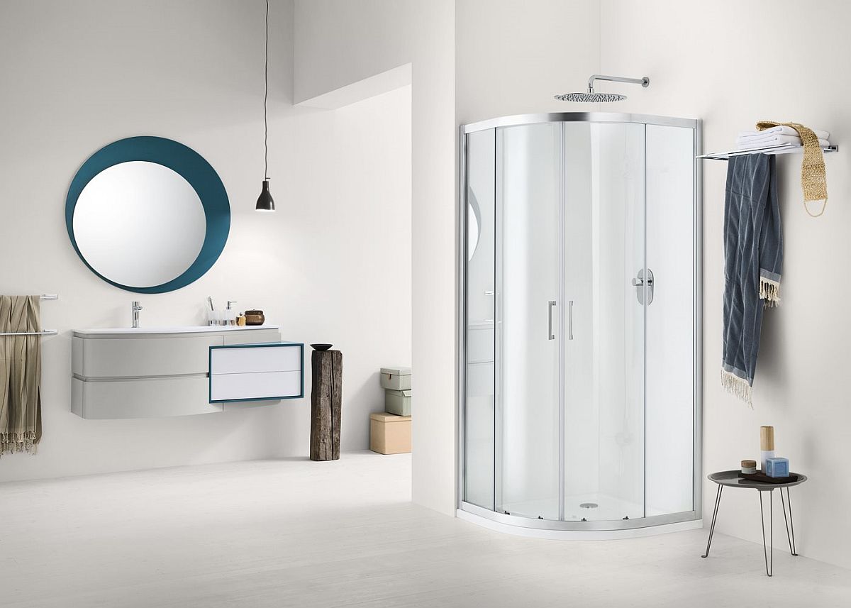 Corner glass shower unit adds to the space-conscious design of the bathroom