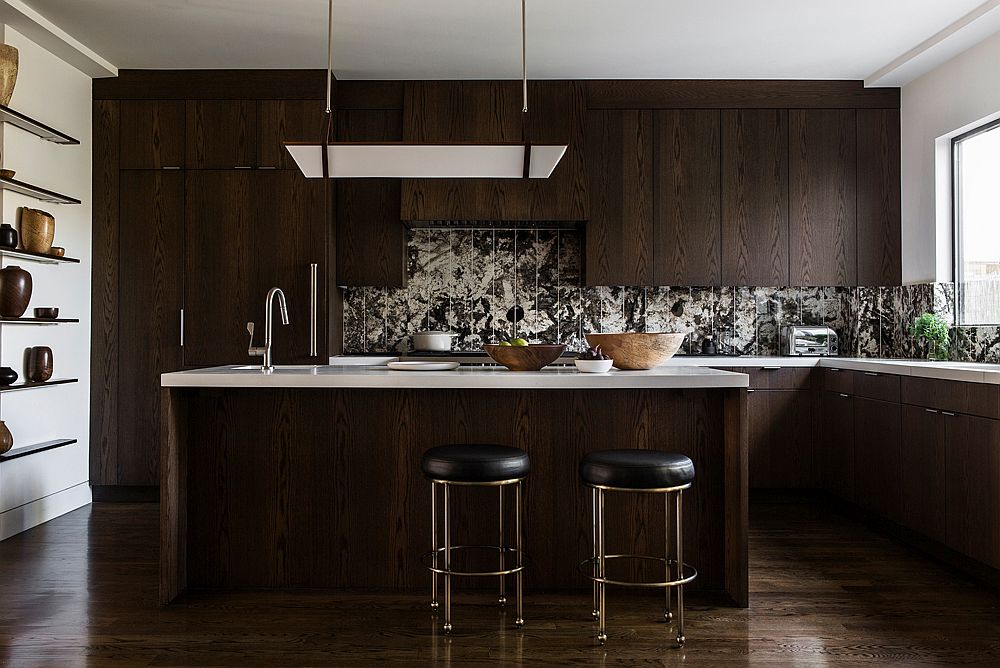 Dark wooden cabinets and a unique backsplash create a stunning modern kitchen