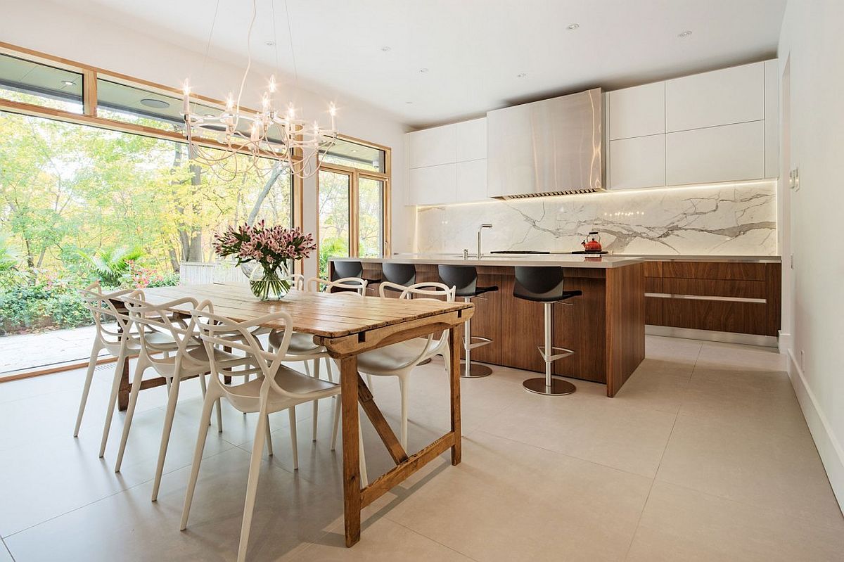 Dining room and kitchen with a cool marble backsplash