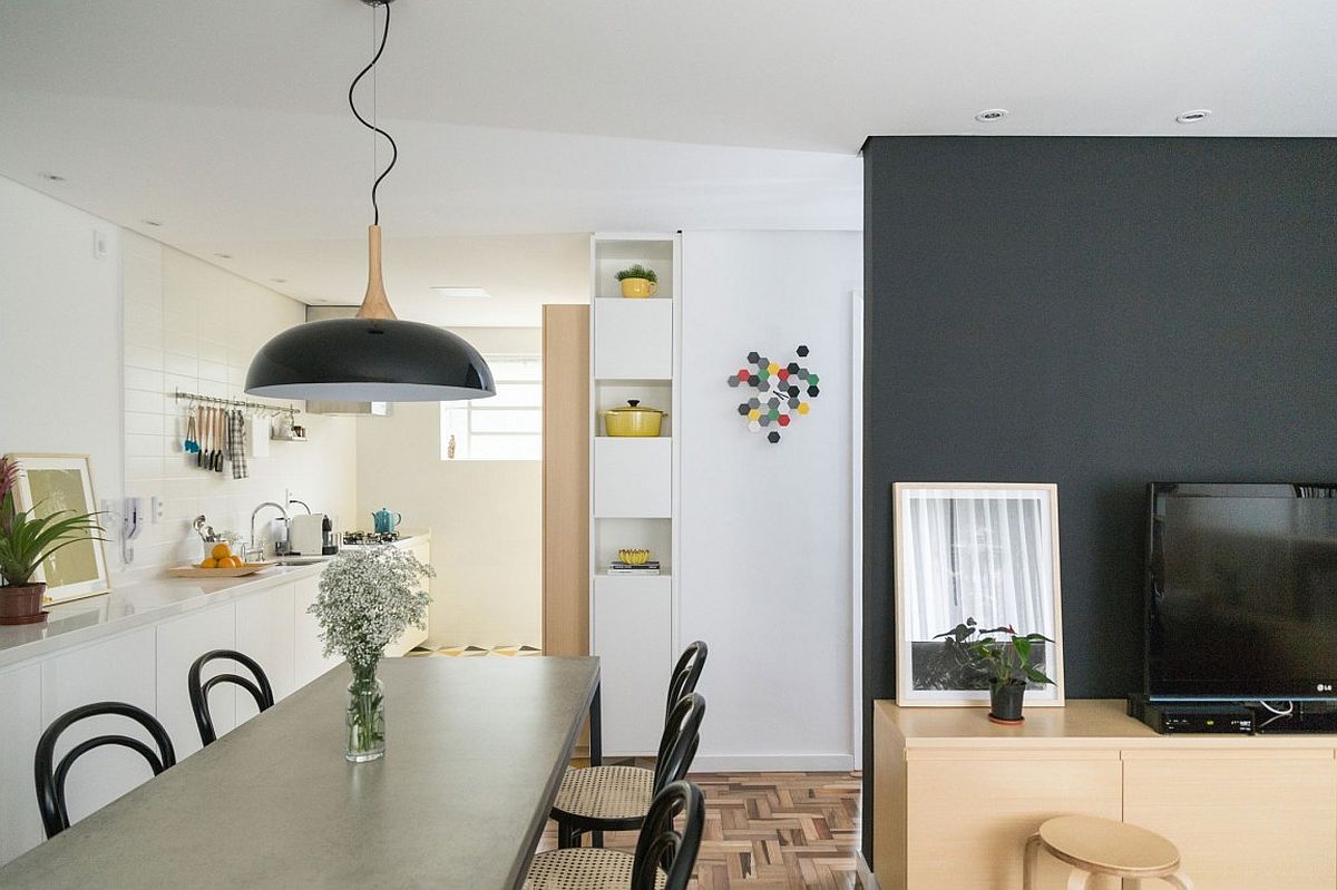 Dining room and modern kitchen of small apartment in Brazil