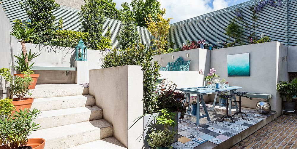 Eclectic patio with Mediterranean flavor thanks to the patchwork tiled flooring [Design: Kingston Lafferty Design / Photography: Donal Murphy]