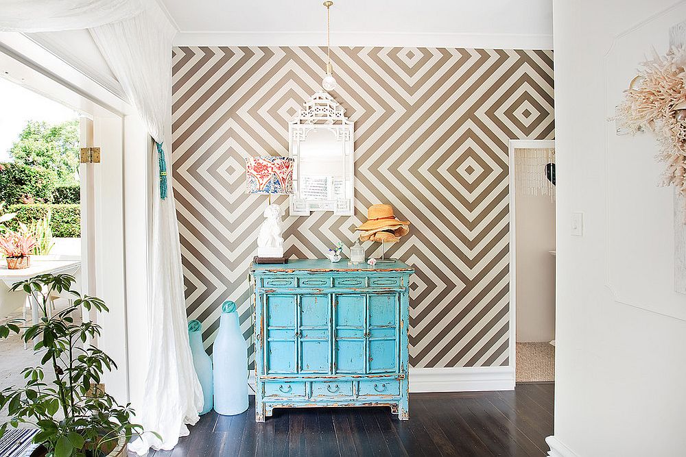 Eclectic with vintage credenza and geometric wallpaper