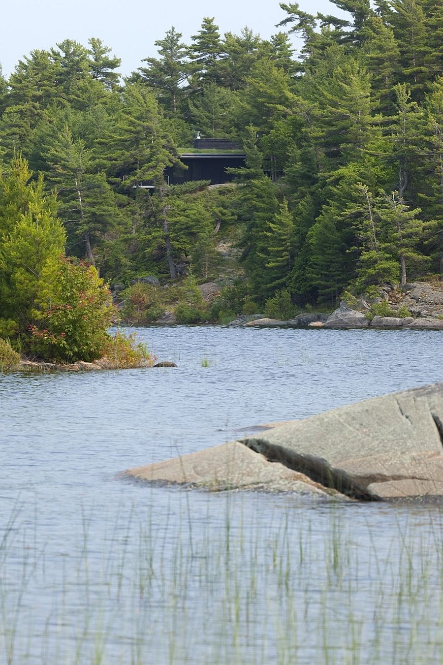 Exquisite cabin retreat becomes one with its landscape when viewed from distance