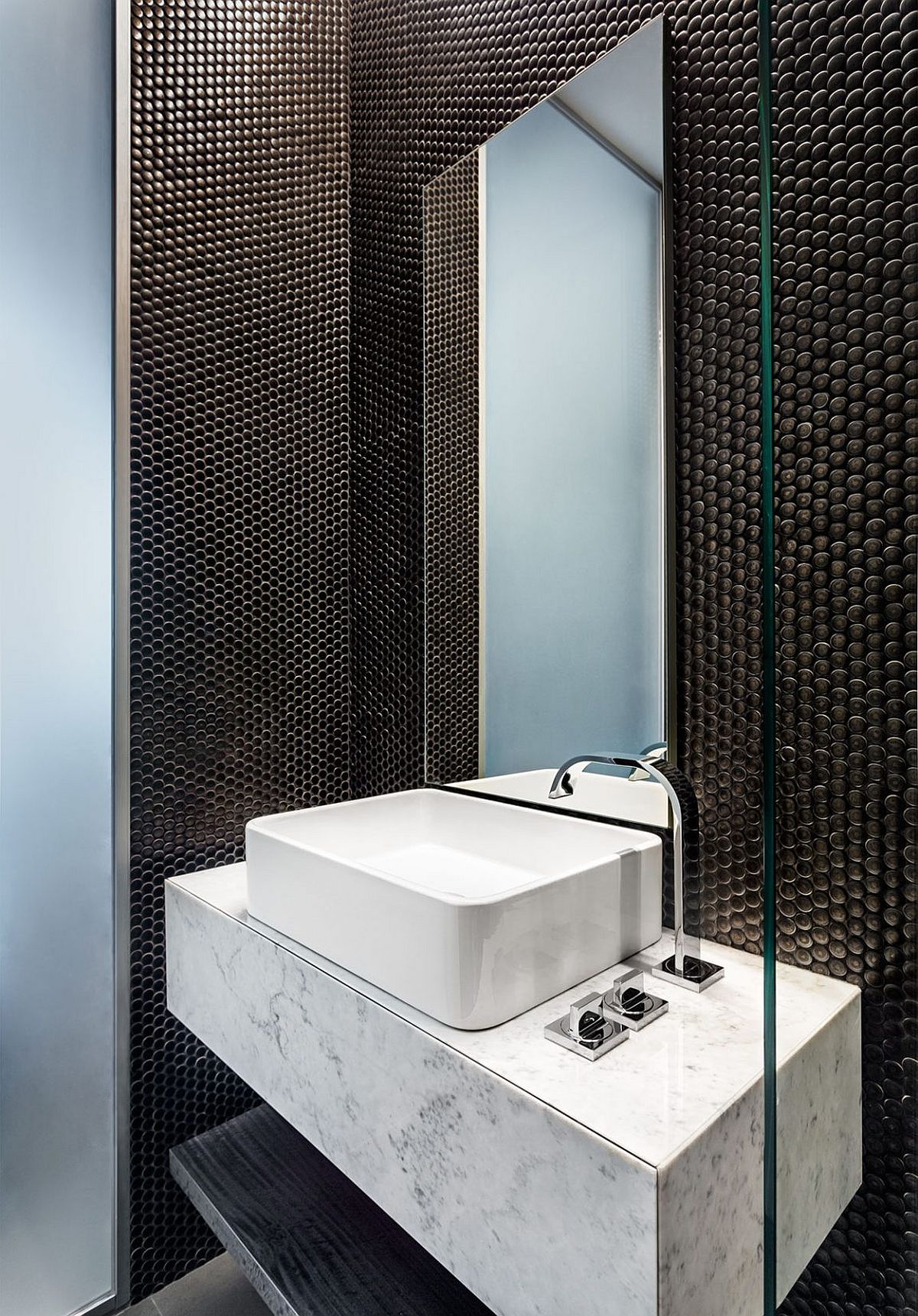 Floating marble vanity makes a bigger visual impact thanks to the black backdrop