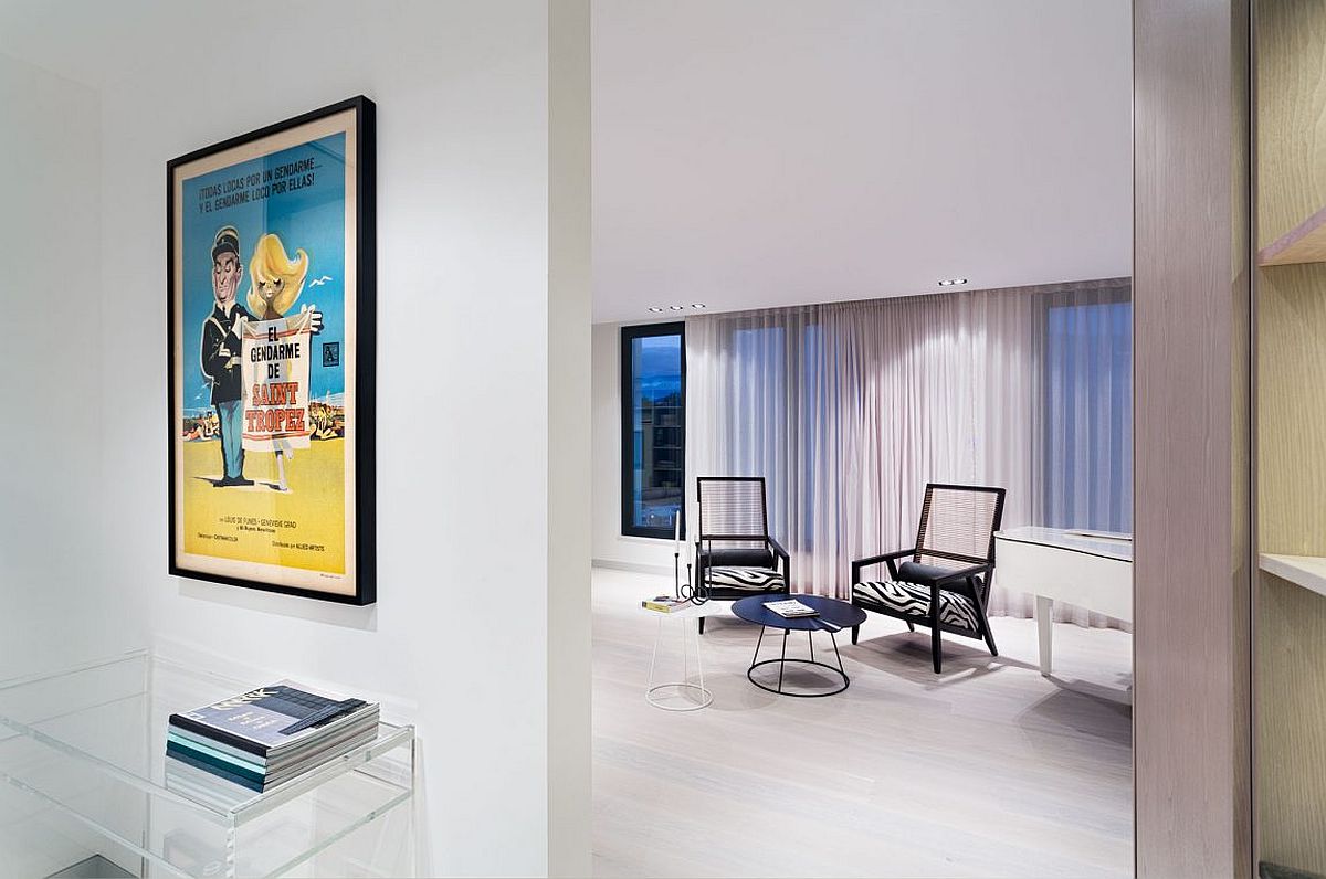 Framed poster brings color and excitement to the neutral penthouse interior