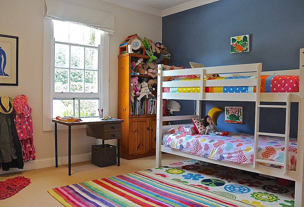 Fun girls' bedroom mixes and matches various colors and patterns [Design: Luci.D Interiors]