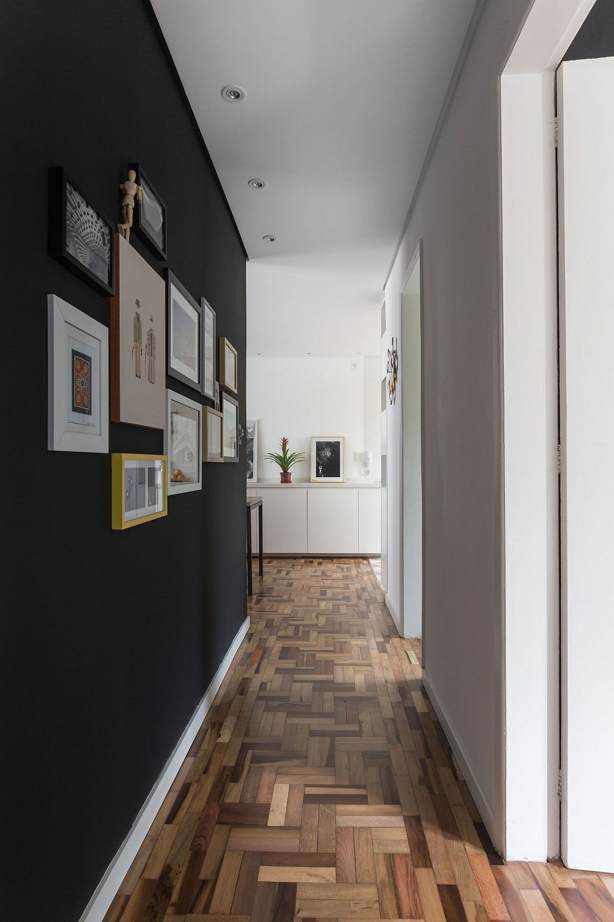 Gallery wall leads way to the bedrooms from the living space