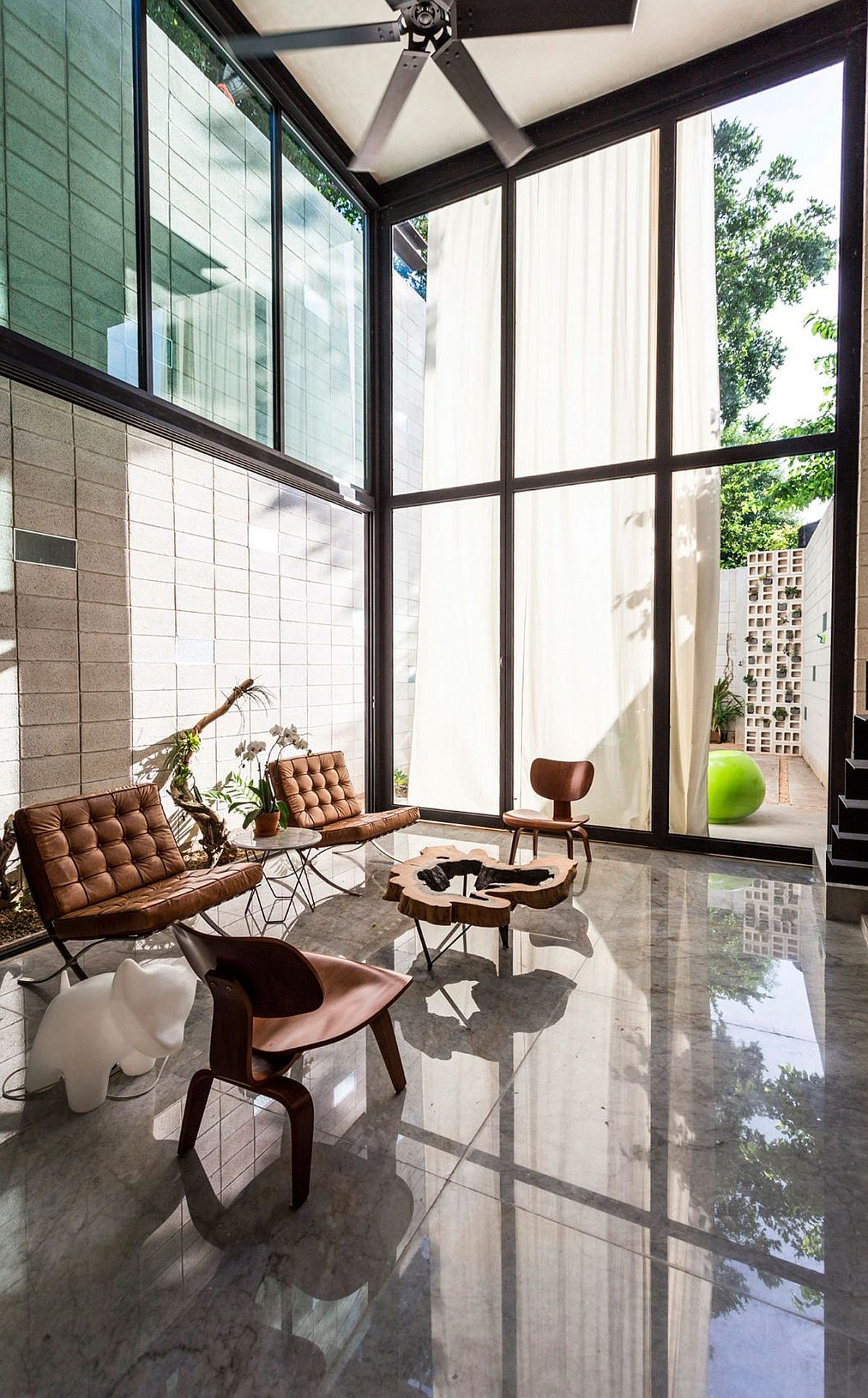 Glass wall with a giant curtain towards the east ushers in natural light