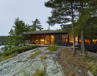 An Island Retreat: Cabin with Green Roof Offers a Cozy, Magical Escape