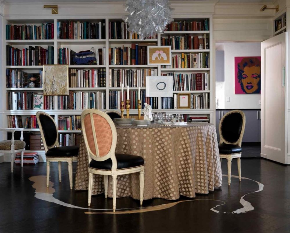 Gold-toned tablecloth in an elegant dining area