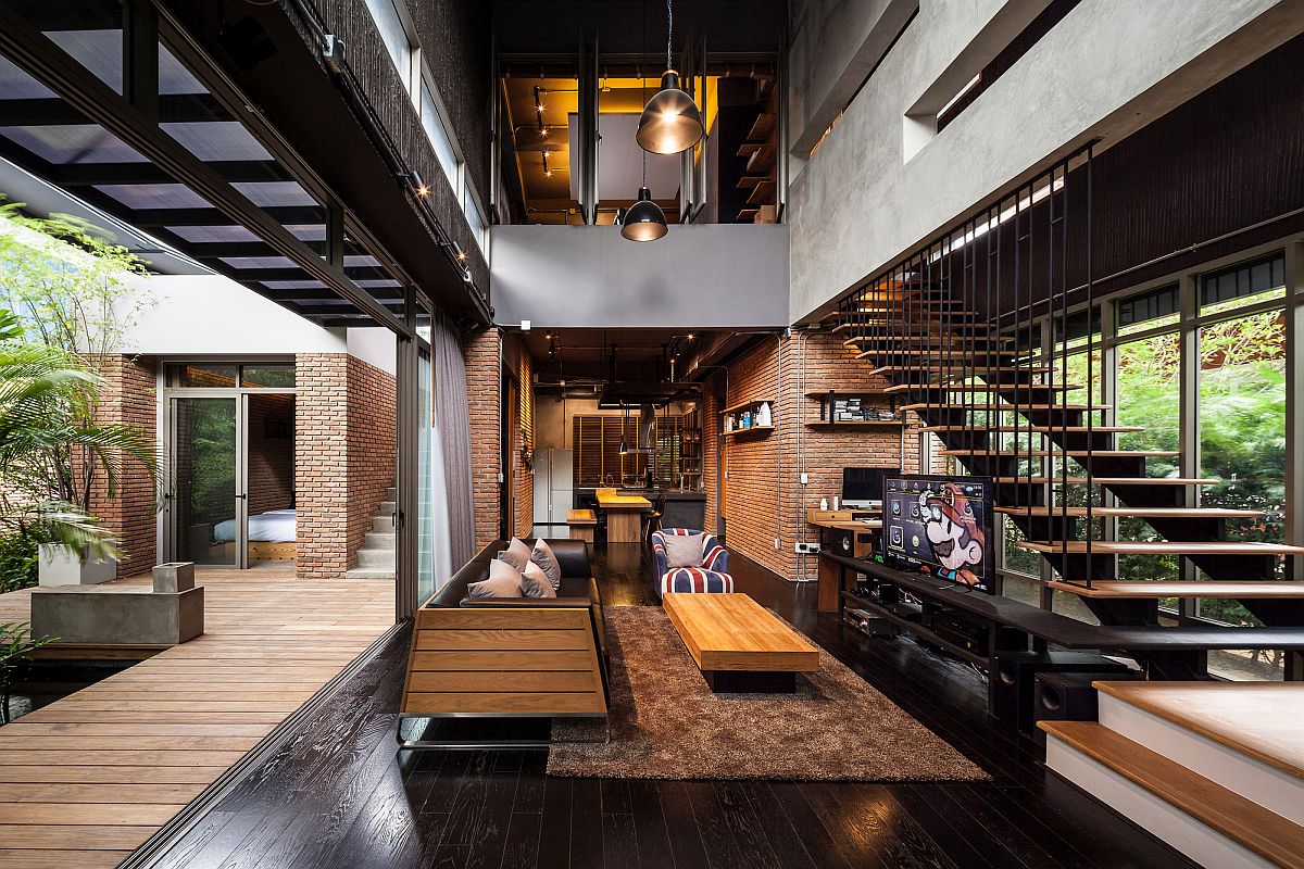 Gorgeous industrial living room of one of the Two Houses in Bangkok, Thailand