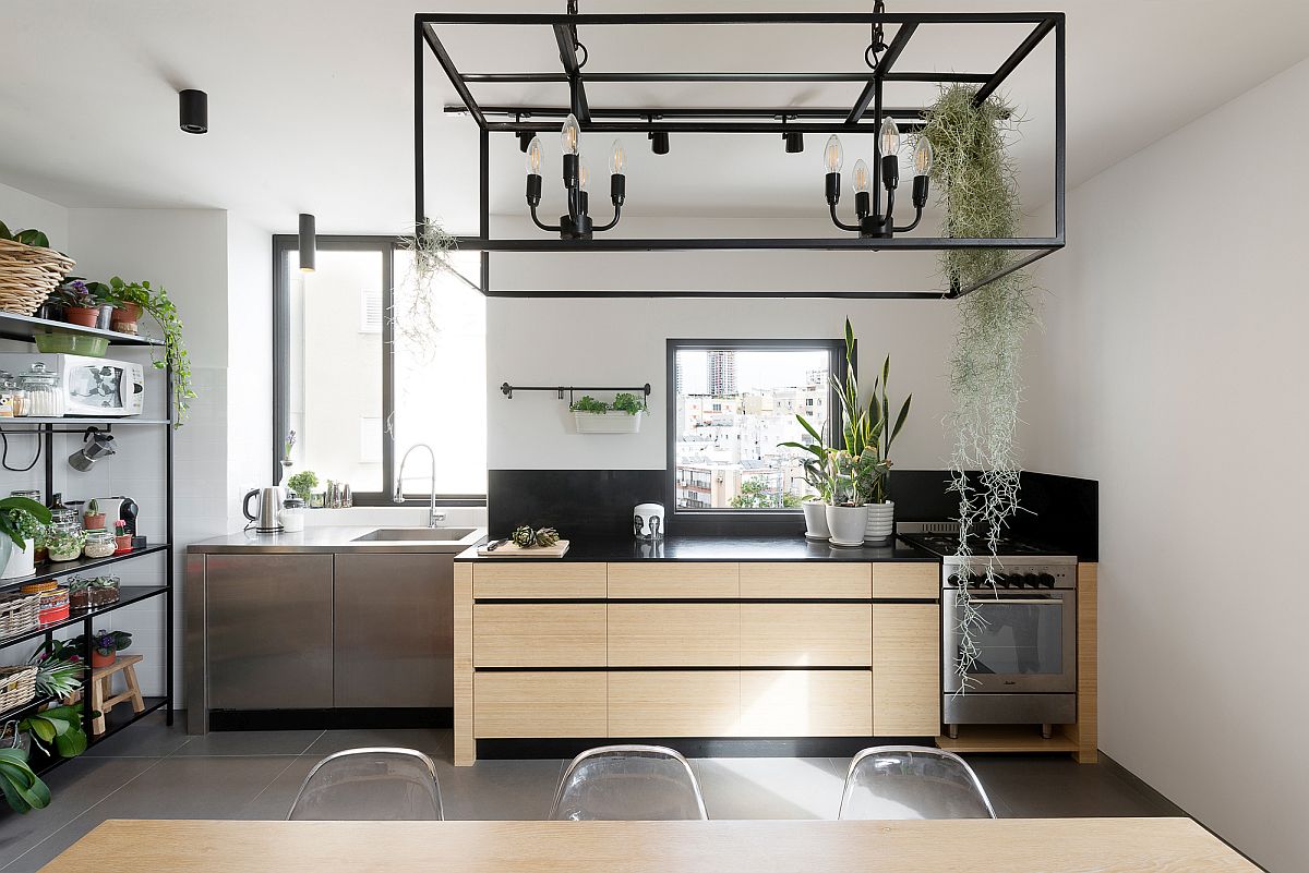 Gorgeous kitchen with dark marble counters and ample natural light