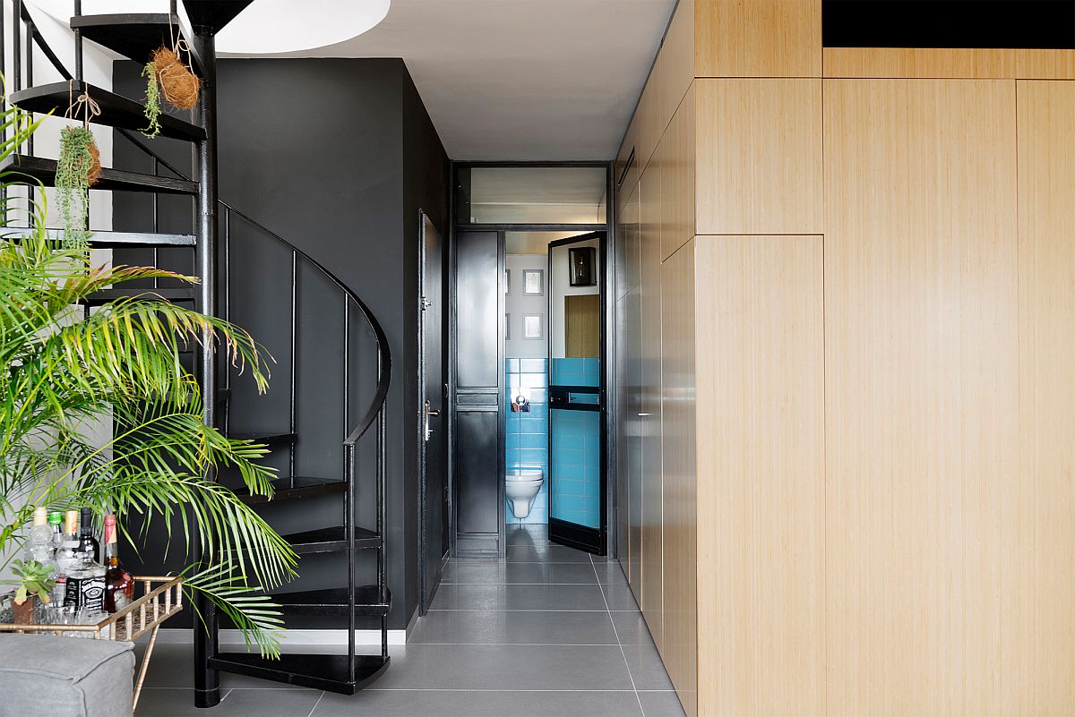 Hallway next to the master bedroom unit and spiral staircase leading to the top floor