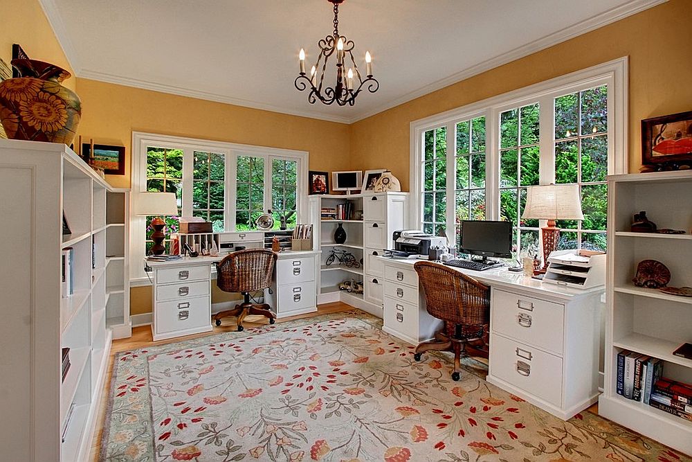 Home office for a couple makes complete use of the corner space on offer with open shelving and cabinets