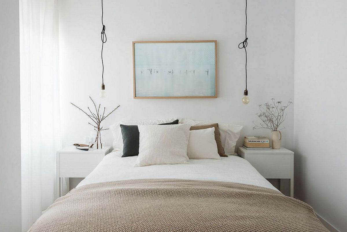 Industrial-styled bedside lighting is simple and minimal