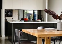 Kitchen-and-dining-space-of-the-Alphington-House-nestled-in-the-single-story-pavilion-structure-217x155