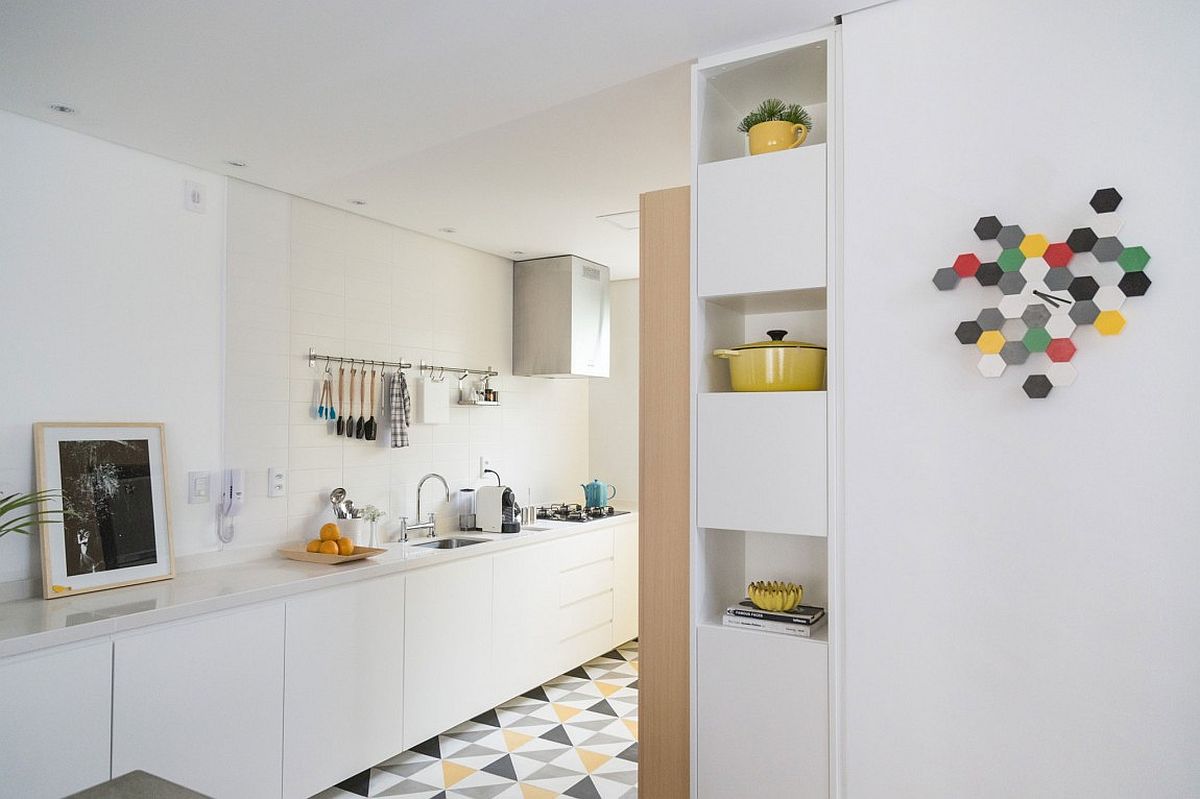 Kitchen in white with geometric floor tiles that add color and contrast