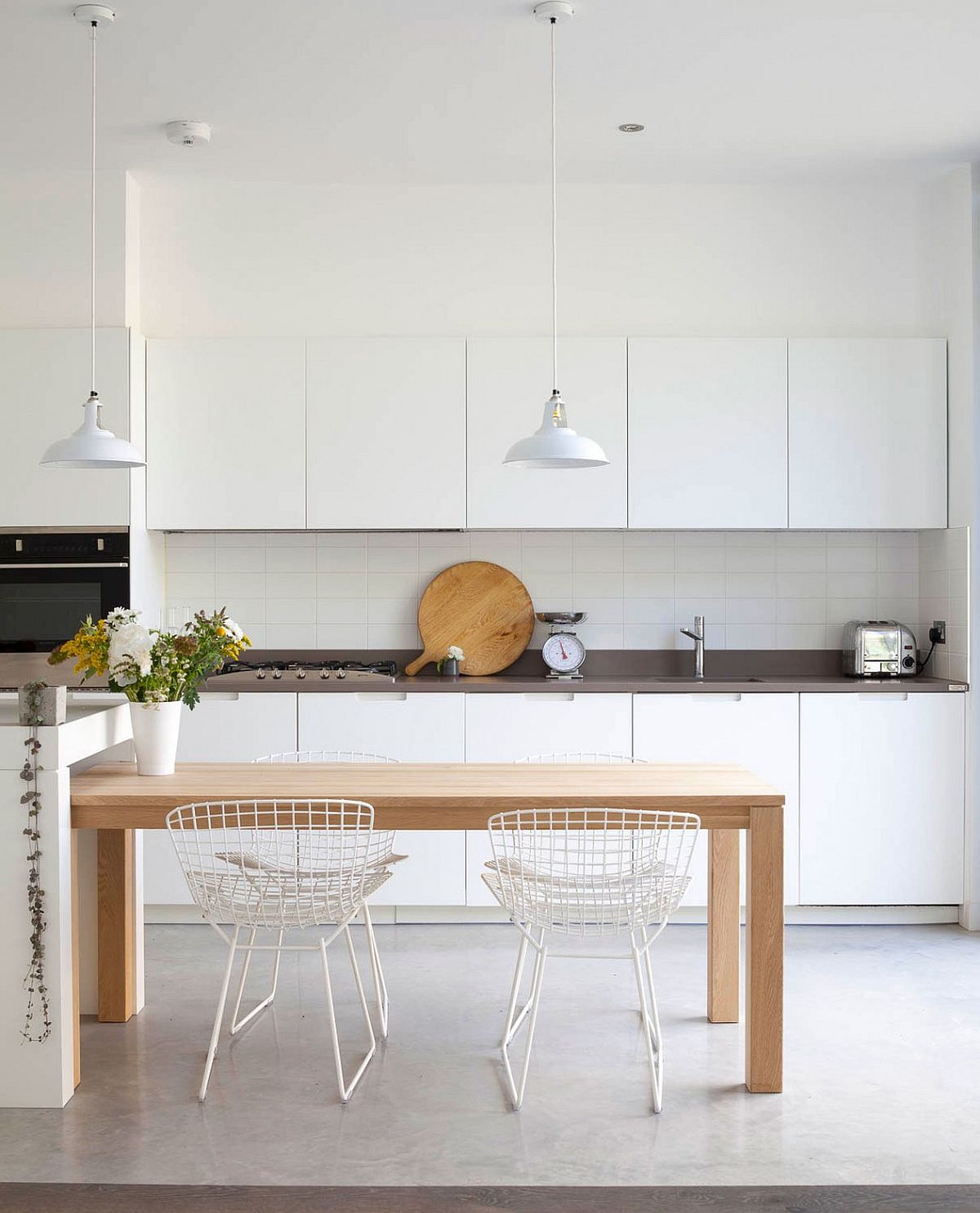 Kitchen table can easily slide under the kitchen island to create additional space