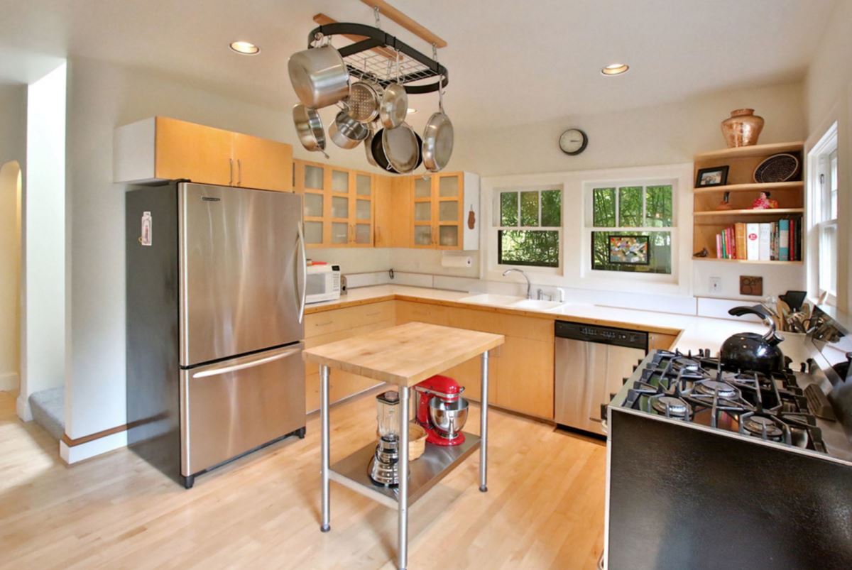 Kitchen with an overhead pot rack