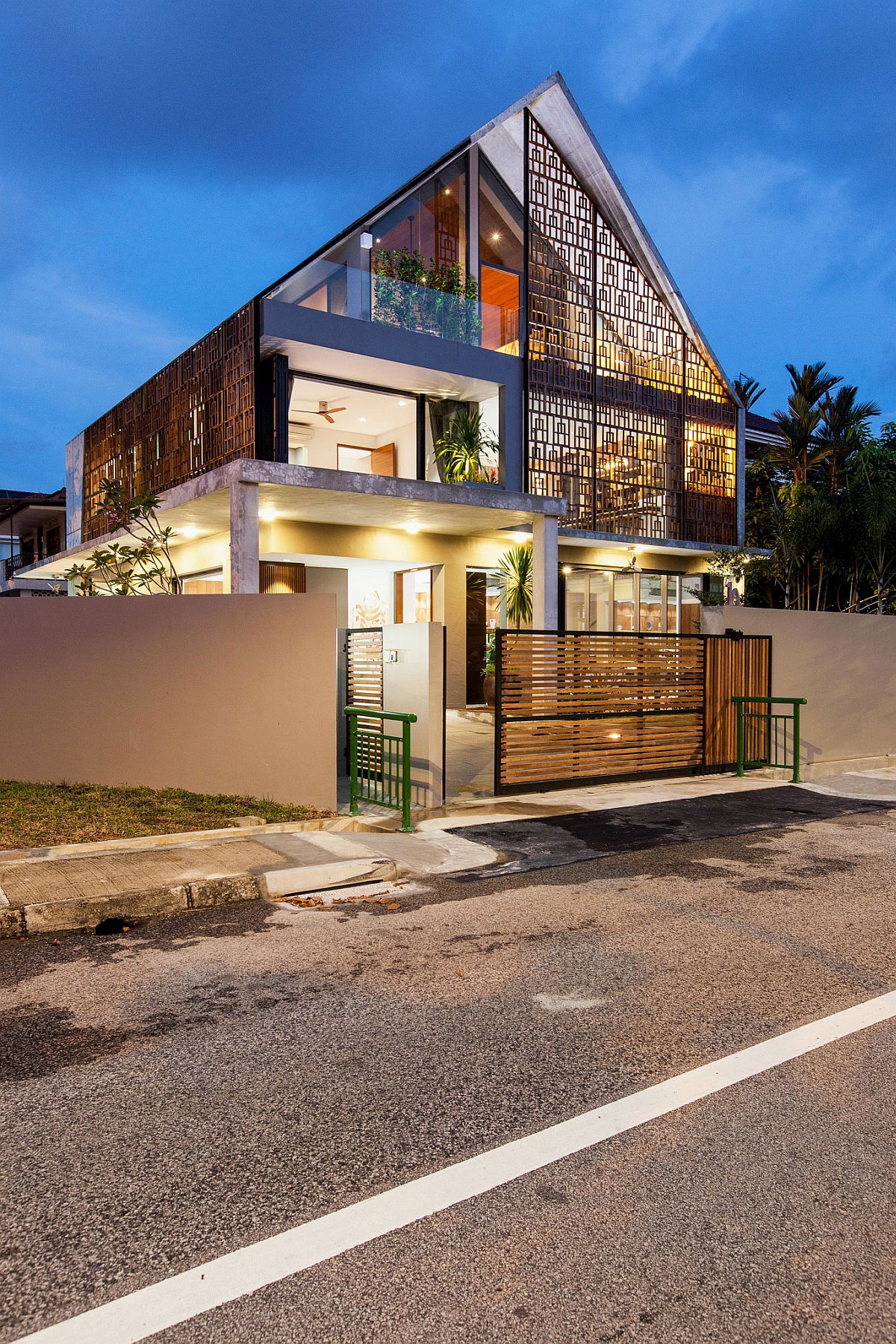 Lighting elevates the style quotient of the unique home in Singapore
