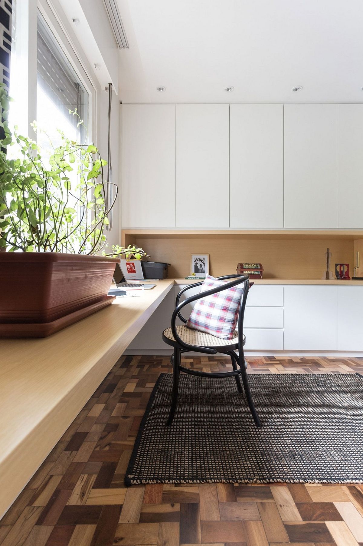 Long wooden desk provides ample space for work and a whole lot more