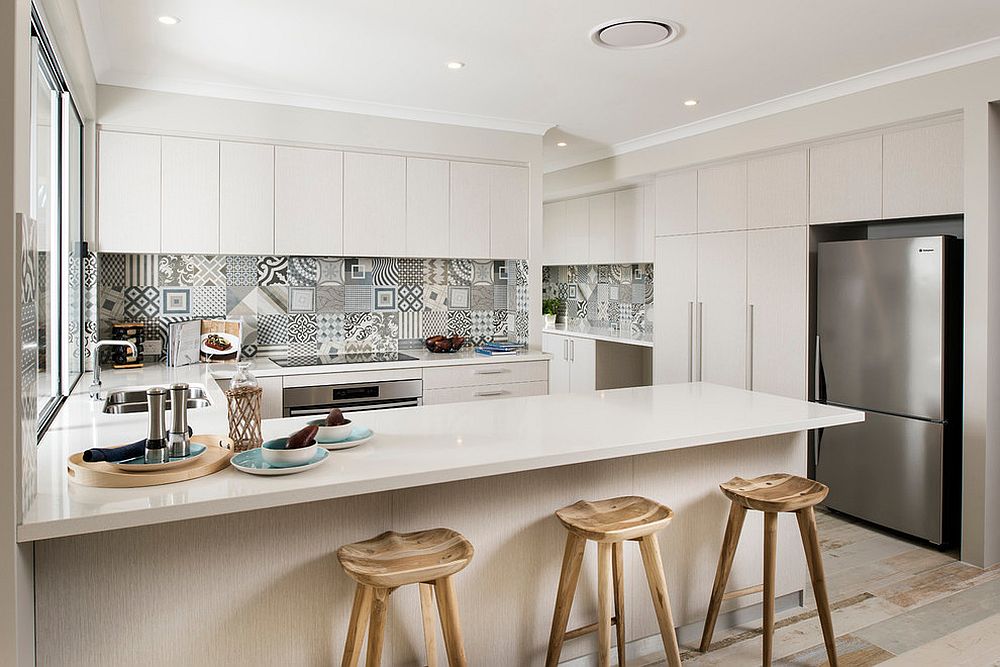 Lovely patchwork tiled backsplash in the kitchen adds color to the Scandinavian setting