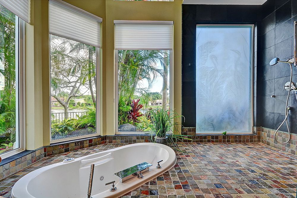 Luxurious tropical bathroom that opens up the view outside [Design: Shelly Preziosi Designs]