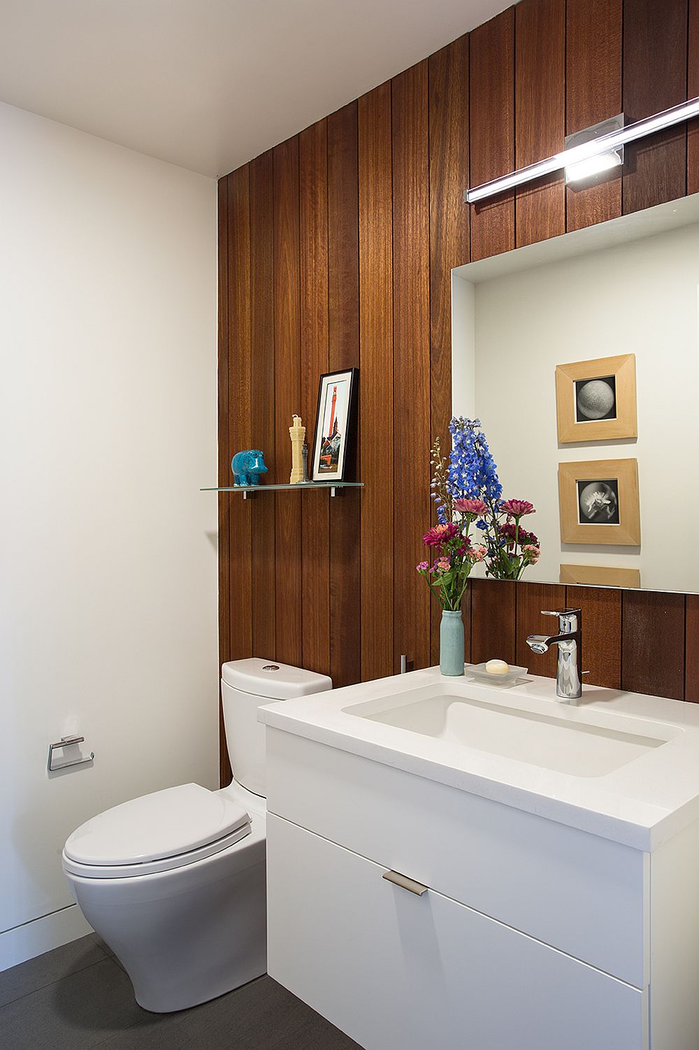 Mahogany panels add elegance to the contemporary bathroom without disturbing the color scheme