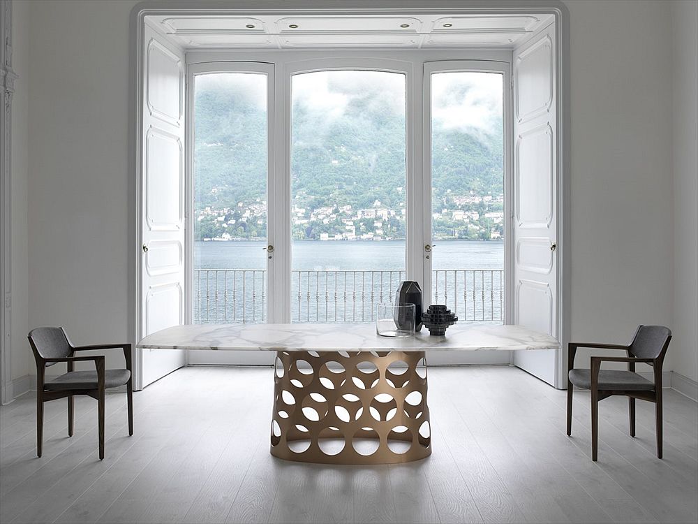 Marble top dining table with cool metal base is a showstopper