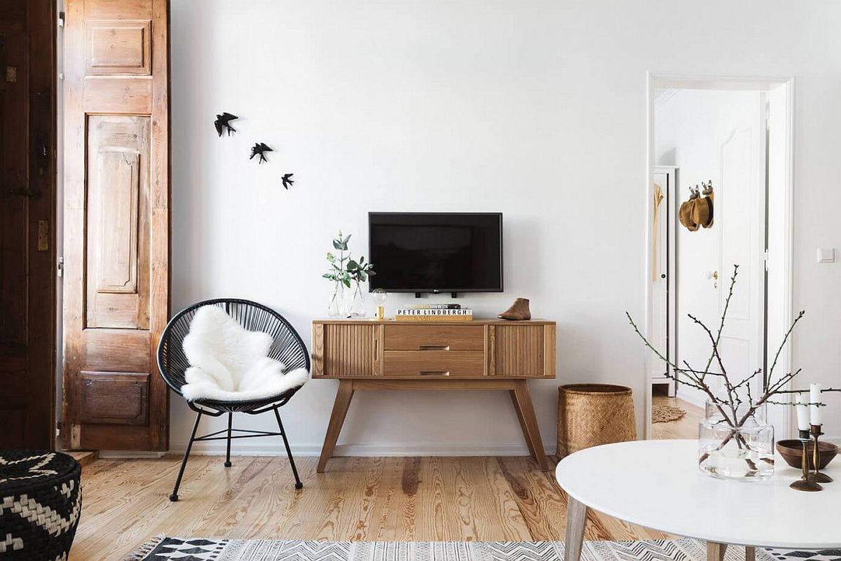 Midcentury modern wooden sidetable below the wall-mounted TV