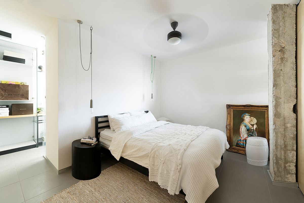 Minimal modern guest bedroom on the top level of the Tel Aviv home