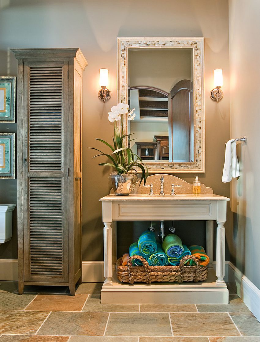 Neatly folded towels and open vanity add color and style to the traditional bathroom [Design: Hostetler Custom Cabinetry]