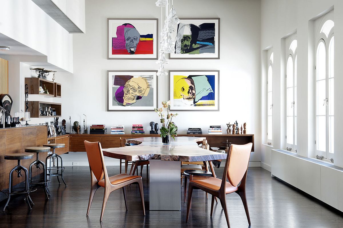 Original Andy Warhol skull prints stand out in the contemporary dining room