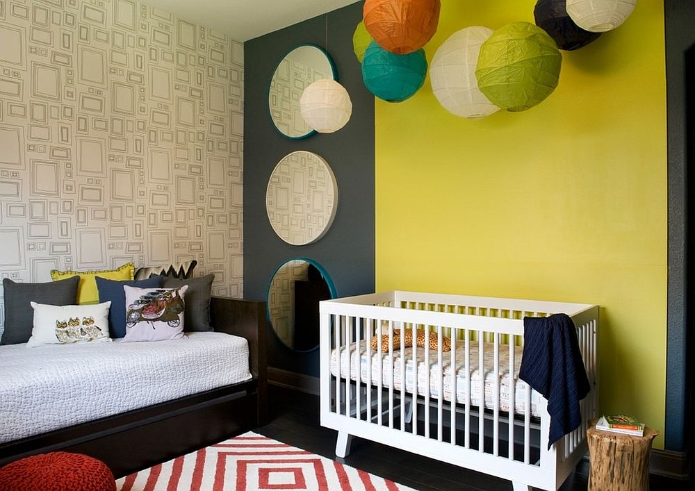 Paper lanterns bring additional color to this nursery in yellow and gray