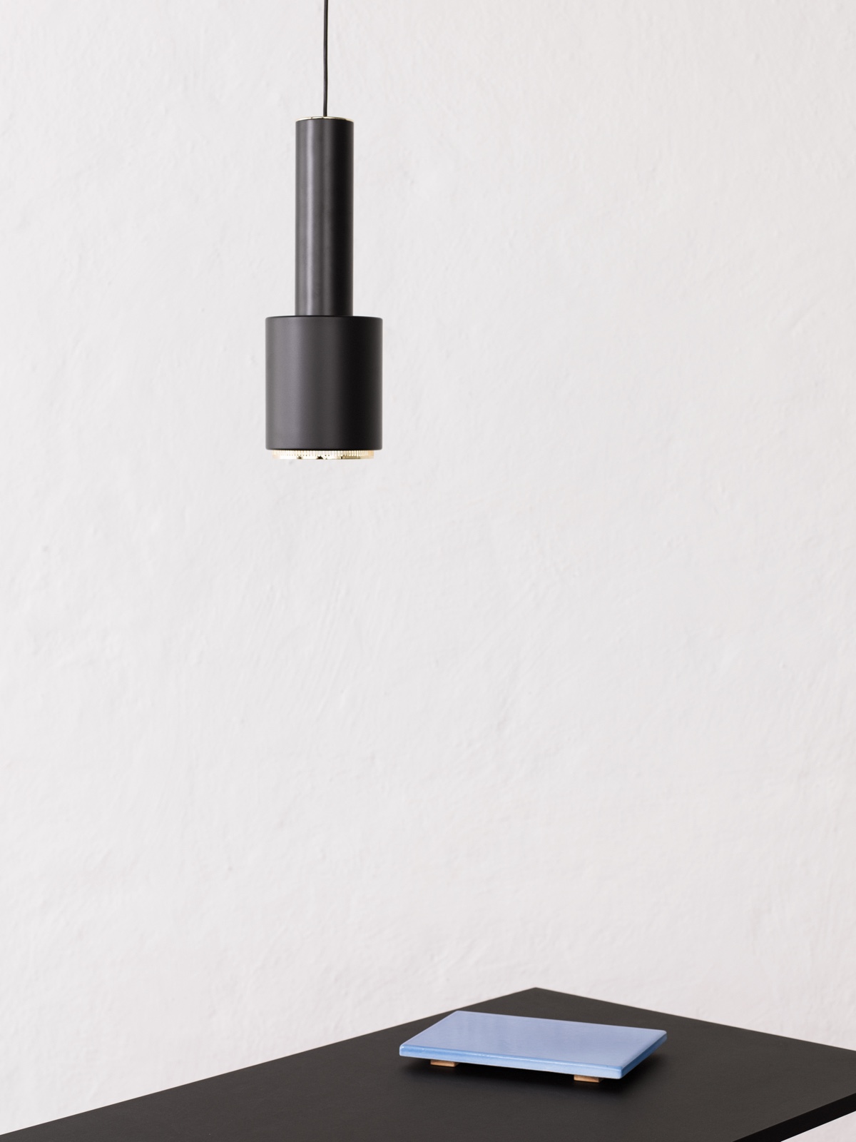 Pendant Light A110, black painted steel shade, designed in 1952. Photo by Osma Harvilahti. Also known as the Hand Grenade lamp, it was designed for the home of the Finnish Engineers' Association (designed by Aalto between 1948 and 1953).