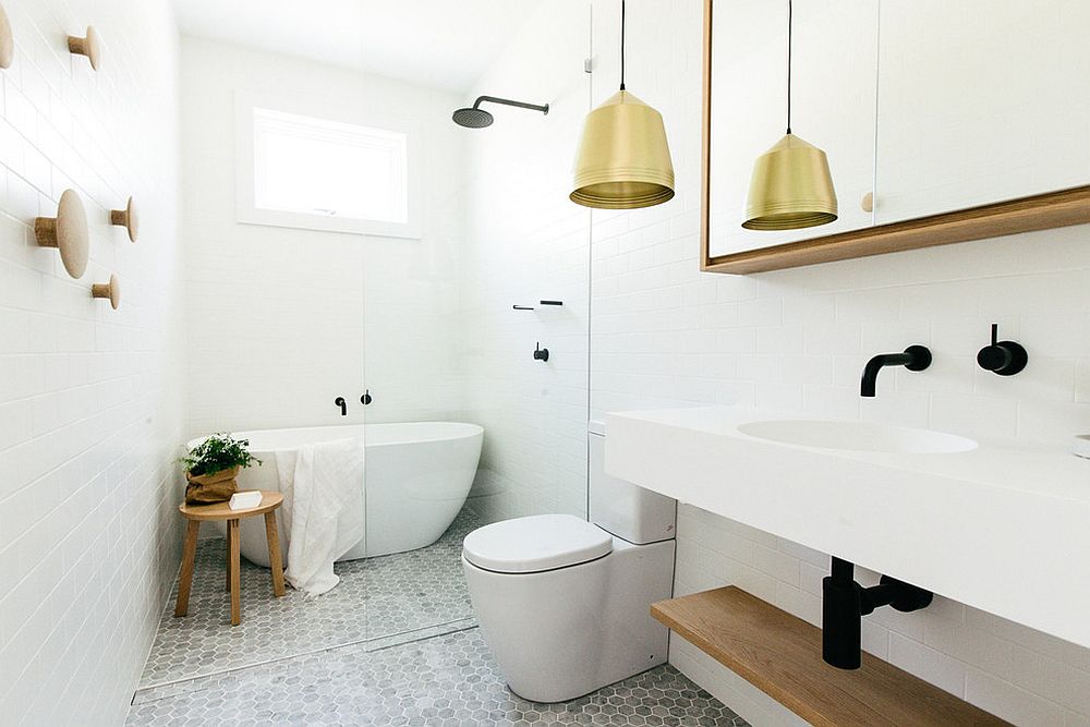 Pendant light adds warm metallic glint to the classy Scandinavian bathroom [From: Caroline McCredie]