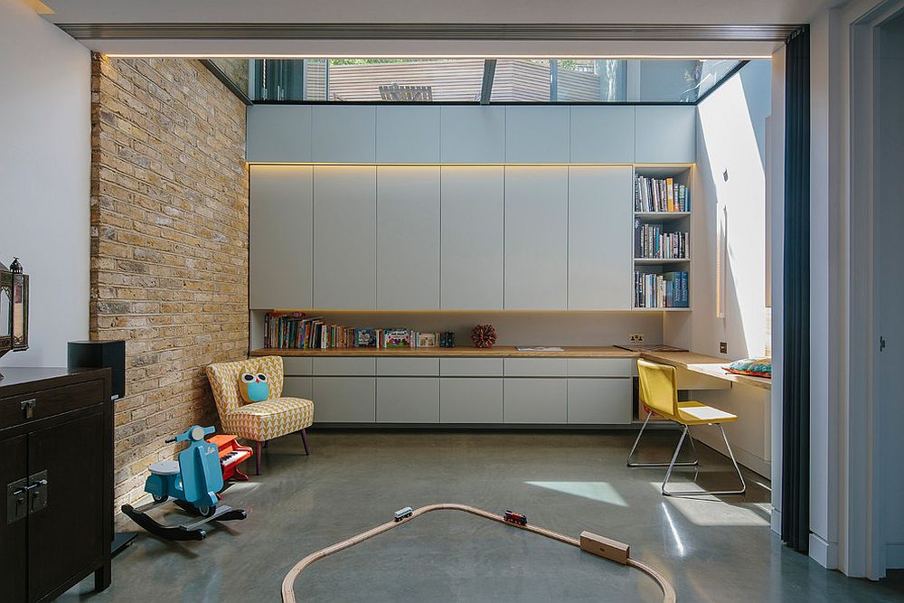 Playroom and kids study with skylight and feature brick wall