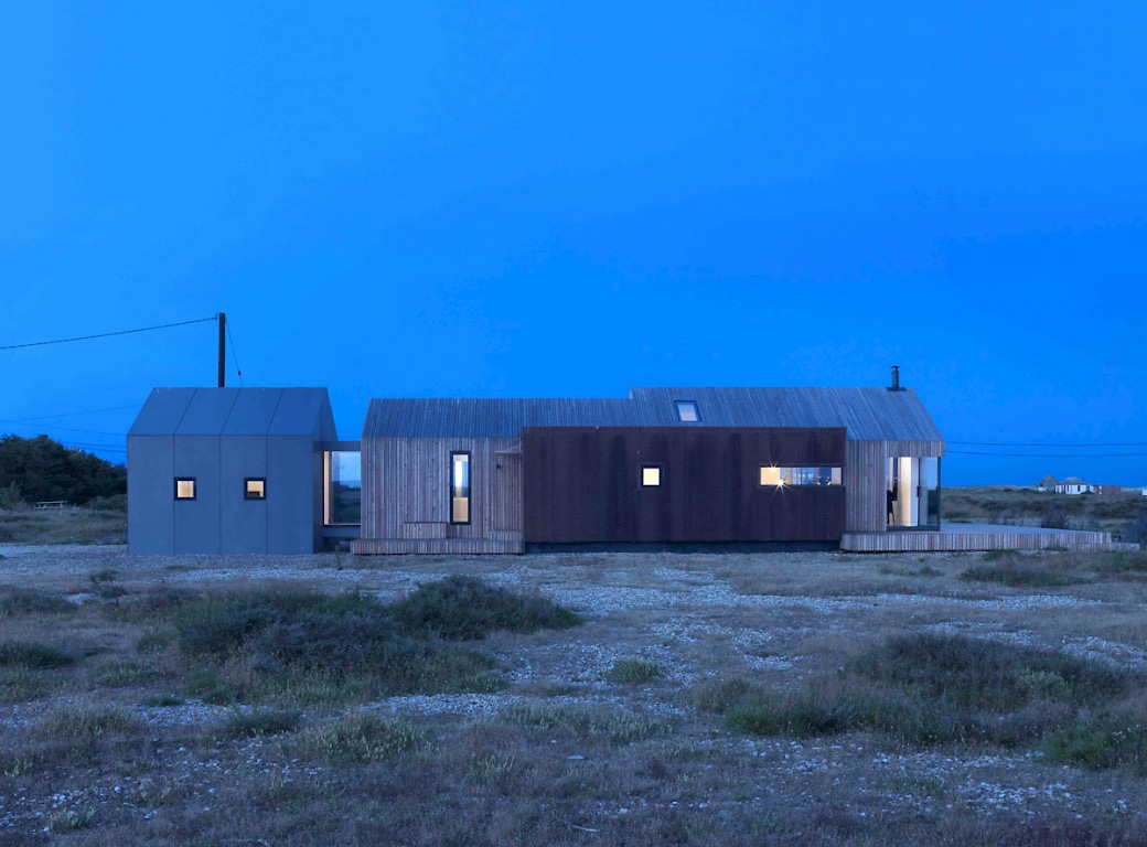 Pobble house at night, on Dungeness beach.