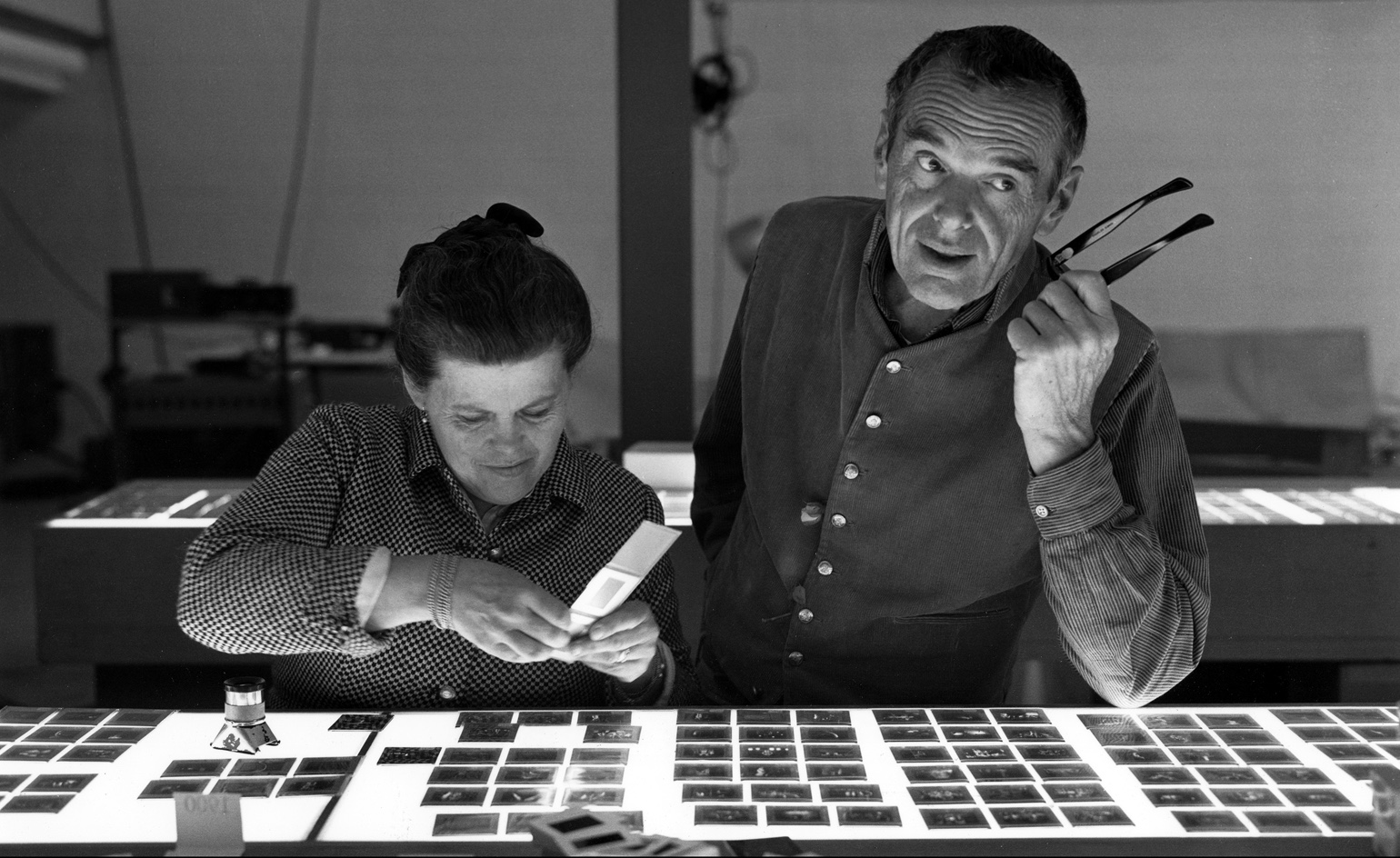 Ray and Charles Eames selecting slides. Image courtesy of Eames Office, LLC via Wallpaper*.