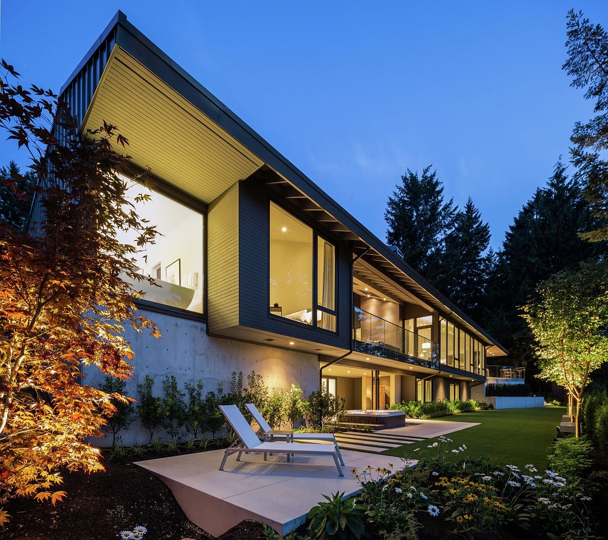 Rear facade of the home opens up to the natural scenery around it