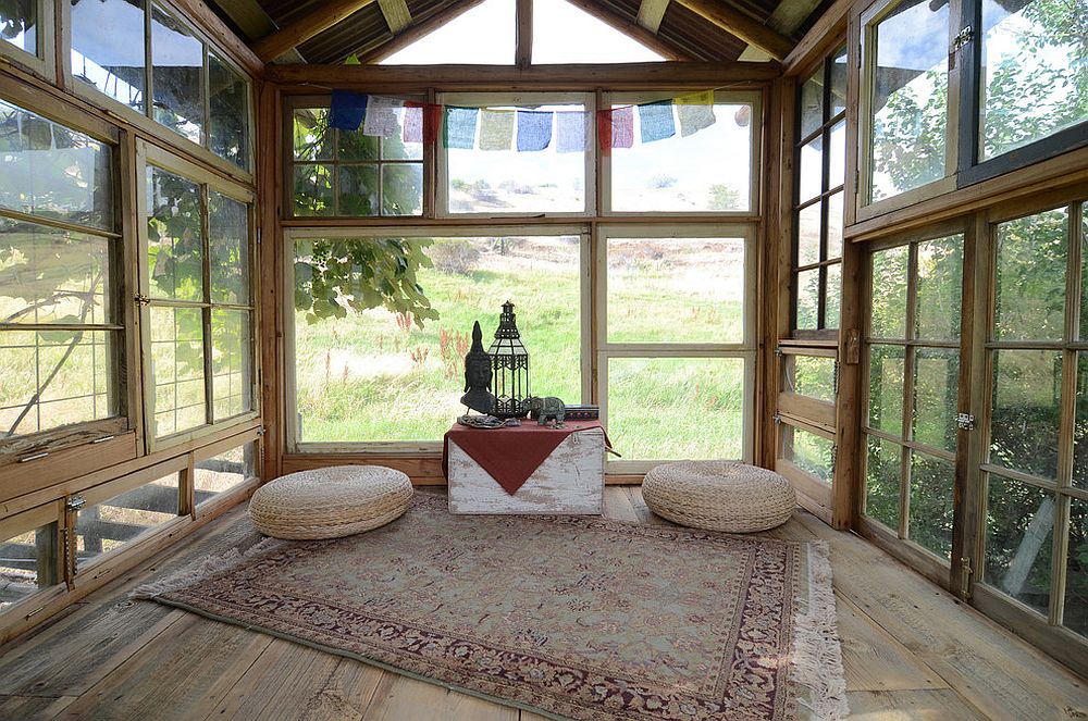 Reclaimed wood and glass shape rustic meditation shed surrounded by greenery [From: Sarah Greenman]