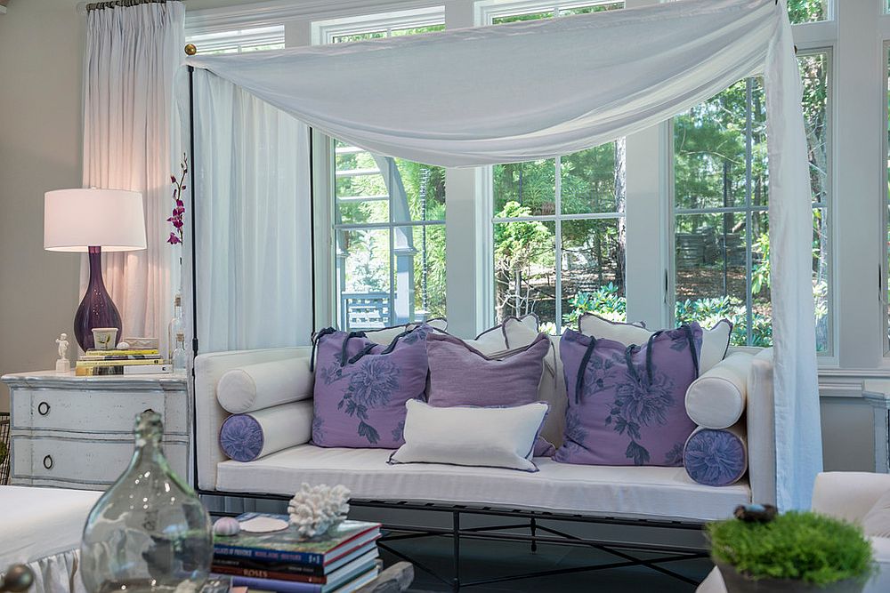 Relaxing daybed inside the sunroom with a splash of purple