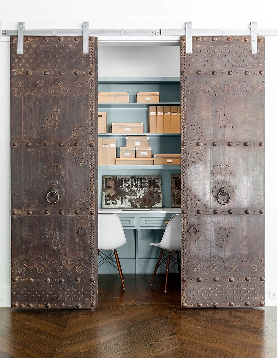 Rustic and antique sliding doors add uniqueness to the small home office