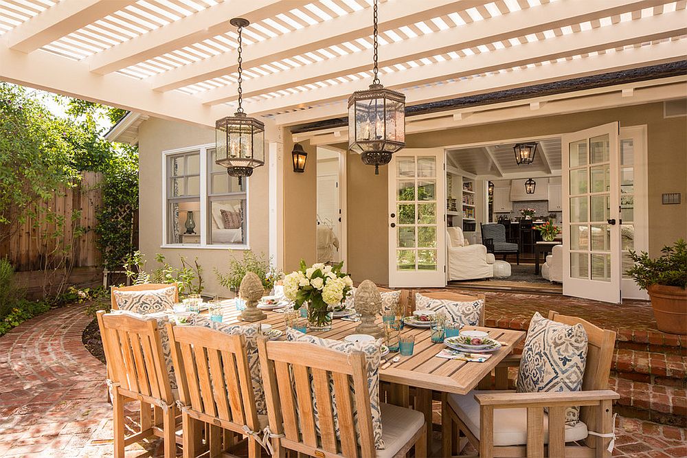 Rustic lanterns complete a beautiful and inviting outdoor dining space