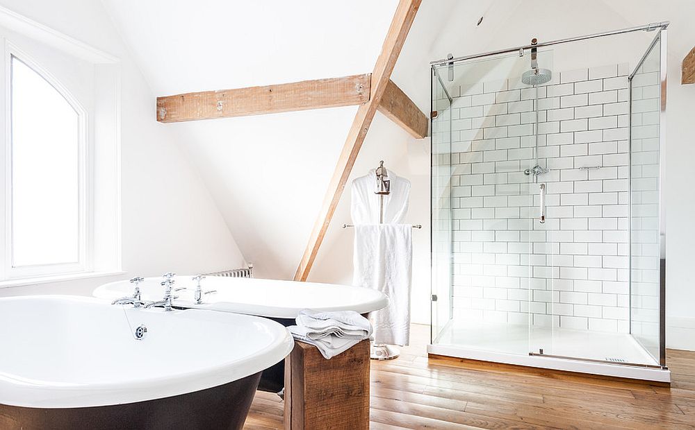 Scandinavian bathroom with standalone bathtub in black [Design: Attila Kemenyfi Photo & Film]