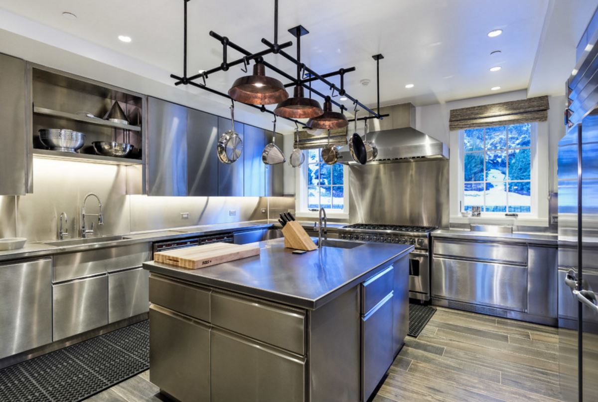 Modern kitchen with a sculptural pot rack