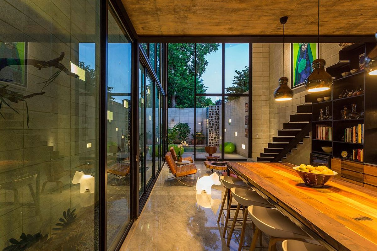 Series of glass walls up up the multi-level home to the world outside