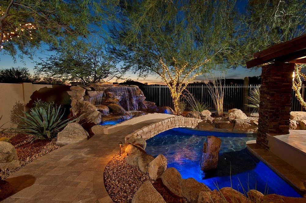 Simple stone bridges are a popular choice for the Mediterranean poolscape [Design: California Pools & Landscape]