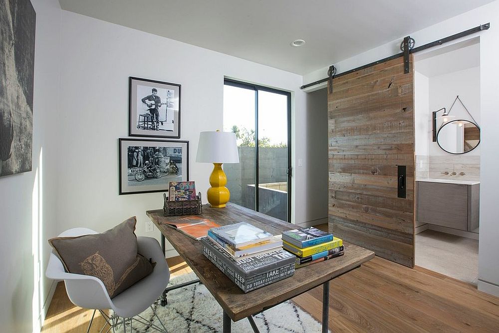 Sliding barn door separates the home office from the small bathroom